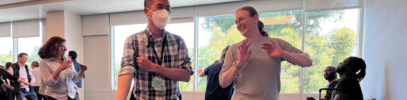 adults dancing at meeting