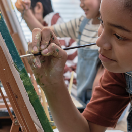 Image of a young african american girl painting